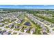 Aerial view of a community with homes that are situated close to a large pond and green trees at 8044 Yarmouth Way, Indianapolis, IN 46239