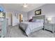 Tranquil bedroom featuring a bed, dresser, and access to other rooms at 8044 Yarmouth Way, Indianapolis, IN 46239