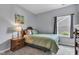 Inviting bedroom featuring a plush bed with a soft comforter and a bedside table at 8044 Yarmouth Way, Indianapolis, IN 46239