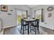 Bright dining area with a modern table set, natural light, and view of the backyard at 8044 Yarmouth Way, Indianapolis, IN 46239