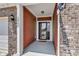 A welcoming entrance with brick siding, leading to a charming front door at 8044 Yarmouth Way, Indianapolis, IN 46239