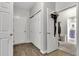 Hallway with storage cabinets leads into the bathroom area with a glass shower at 8044 Yarmouth Way, Indianapolis, IN 46239