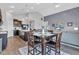 Open-concept living space with a dining area, kitchen, and comfortable living room furniture at 8044 Yarmouth Way, Indianapolis, IN 46239