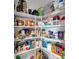 Organized pantry with wire shelves filled with various food items and storage containers at 8044 Yarmouth Way, Indianapolis, IN 46239