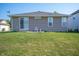 The backyard has a well-maintained lawn and a patio with a chair, perfect for outdoor relaxation at 8199 Sydney Ln, Avon, IN 46123
