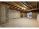 Unfinished basement showcasing open framework and concrete walls, offering a versatile space at 8199 Sydney Ln, Avon, IN 46123