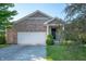 Charming brick home featuring an attached two-car garage and well-maintained landscaping at 8199 Sydney Ln, Avon, IN 46123