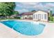 In-ground swimming pool, deck, diving board and furniture in backyard setting with privacy fence at 8209 Burn Ct, Indianapolis, IN 46217