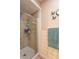 Bathroom with a tiled shower, cabinets, tile walls, decor, and vanity at 8209 Burn Ct, Indianapolis, IN 46217