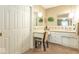 A full bathroom with a vanity, mirrors, and hanging lights is connected to the main bedroom at 8209 Burn Ct, Indianapolis, IN 46217