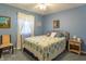 Bedroom with a light blue paint, a ceiling fan, carpet, closet, and natural light at 8209 Burn Ct, Indianapolis, IN 46217