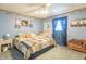 Bedroom featuring blue walls, a ceiling fan, carpet, closet, and natural light at 8209 Burn Ct, Indianapolis, IN 46217