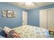 Bedroom with blue walls, a ceiling fan, carpet, closet, and an accent wall at 8209 Burn Ct, Indianapolis, IN 46217