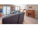 Open concept living area connecting to a bright sunroom and featuring a comfortable gray sofa at 8209 Burn Ct, Indianapolis, IN 46217