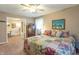 Relaxing main bedroom with a view of the en-suite bathroom and features colorful decor at 8209 Burn Ct, Indianapolis, IN 46217