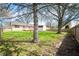 Backyard featuring mature trees, deck and shed at 829 Meadow Ln, Greenfield, IN 46140