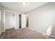 Carpeted bedroom with walk-in closet and neutral paint at 829 Meadow Ln, Greenfield, IN 46140