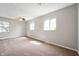 Spacious bedroom with neutral walls, carpet, and natural light from three windows at 829 Meadow Ln, Greenfield, IN 46140