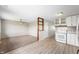 Bright kitchen with white cabinetry, stainless oven, tile backsplash, and vinyl flooring at 829 Meadow Ln, Greenfield, IN 46140