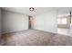 Spacious living room featuring fresh paint and new carpet with hallway leading to other rooms at 829 Meadow Ln, Greenfield, IN 46140