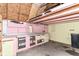 Unfinished basement featuring work bench and storage area at 8445 Montery Rd, Indianapolis, IN 46226