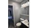 Stylish bathroom featuring a modern vanity, updated lighting, and a toilet at 8445 Montery Rd, Indianapolis, IN 46226