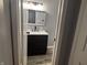 Bathroom featuring a dark vanity with a white marble top and contemporary fixtures at 8445 Montery Rd, Indianapolis, IN 46226