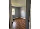 Bedroom showcasing hardwood floors, a neutral color palette, and natural light at 8445 Montery Rd, Indianapolis, IN 46226