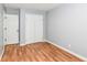 Bedroom featuring hardwood floors, neutral paint, and a closet at 8445 Montery Rd, Indianapolis, IN 46226