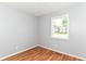 Bedroom featuring new flooring and a window at 8445 Montery Rd, Indianapolis, IN 46226