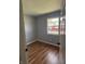 Cozy bedroom featuring hardwood floors, freshly painted walls, and natural light at 8445 Montery Rd, Indianapolis, IN 46226