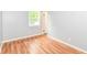 Bright bedroom features hardwood floors, a window and neutral paint at 8445 Montery Rd, Indianapolis, IN 46226