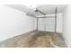 Clean garage with a new door, fresh paint, and an electric door opener at 8445 Montery Rd, Indianapolis, IN 46226