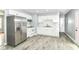 The modern kitchen has stainless steel appliances and white cabinets at 8445 Montery Rd, Indianapolis, IN 46226