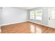 Bright living room featuring hardwood flooring and windows at 8445 Montery Rd, Indianapolis, IN 46226