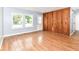 Inviting living room features hardwood floors, abundant natural light and wood accent wall at 8445 Montery Rd, Indianapolis, IN 46226