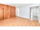 Spacious living room with hardwood flooring, wood accent wall, and ample natural light at 8445 Montery Rd, Indianapolis, IN 46226