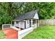 Charming playhouse with white trim and a red deck at 8445 Montery Rd, Indianapolis, IN 46226
