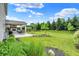 Lush backyard featuring a covered patio and mature trees at 848 Silverheels Dr, Westfield, IN 46074