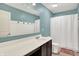 Bright bathroom with a large mirror, a single sink vanity, and a shower with a curtain at 848 Silverheels Dr, Westfield, IN 46074