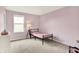 Simple bedroom with pink walls, a single bed, and carpeted floors at 848 Silverheels Dr, Westfield, IN 46074