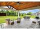Spacious covered patio with outdoor furniture overlooking the landscaped backyard at 848 Silverheels Dr, Westfield, IN 46074