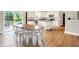 Bright kitchen connected to the dining area, featuring stainless steel appliances and white cabinetry at 848 Silverheels Dr, Westfield, IN 46074