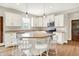 Well-lit kitchen boasting white cabinets, stainless steel appliances, and a central island with seating at 848 Silverheels Dr, Westfield, IN 46074