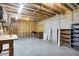 Spacious unfinished basement with workbench and utility connections, ready for customization at 8619 Wrangler Ct, Indianapolis, IN 46217