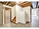 Unfinished basement with concrete floor, exposed ceiling, stairs, and utility options at 8619 Wrangler Ct, Indianapolis, IN 46217