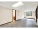 Large, open basement with a utility room on the far side and a window for egress at 8619 Wrangler Ct, Indianapolis, IN 46217