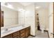 Bathroom featuring double sink vanity and shower/tub with curtain at 8619 Wrangler Ct, Indianapolis, IN 46217