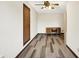 Bedroom featuring a desk, ceiling fan, a door to another room, and light colored walls at 8619 Wrangler Ct, Indianapolis, IN 46217