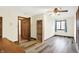 Bedroom featuring a window, a bookshelf, a door to another room, and light colored walls at 8619 Wrangler Ct, Indianapolis, IN 46217